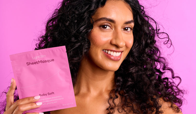 Image of woman holding a SheetMasque package